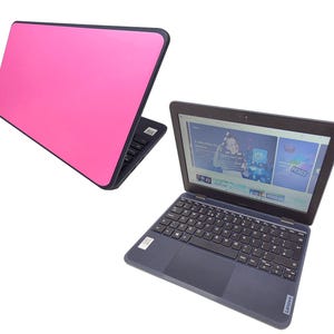 May include: Two laptops are shown. One has a bright pink lid and a black frame. The other is open, displaying a website on the screen and a black keyboard. The laptop is dark blue with the brand name Lenovo.