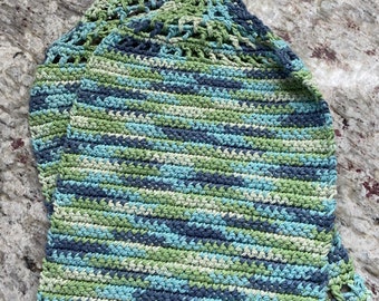 May include: A crocheted dishcloth with a blue, green, and white color scheme. The dishcloth has two loops at the top with white buttons.