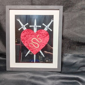 3 of swords snake skeleton frame