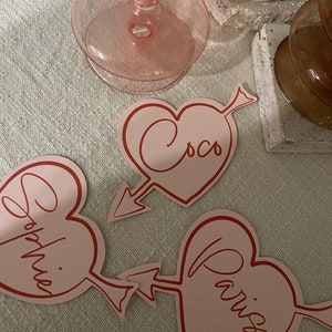 Calligraphy heart shape place card cupid