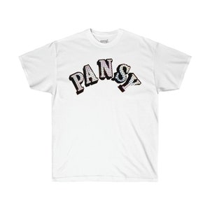 May include: White t-shirt with a black and iridescent graphic of the word "PANSY" in a varsity style font.