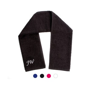 May include: A black towel with the initials "JW" embroidered in white on one end.