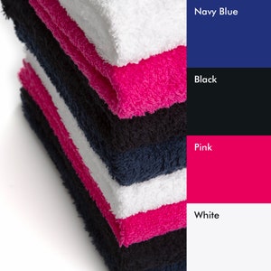 May include: Stack of towels in navy blue, black, pink, and white colors.