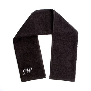 May include: Black cotton towel with white embroidered initials "JW".
