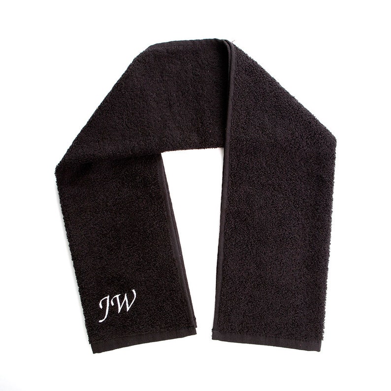 May include: Black cotton towel with white embroidered initials "JW".