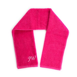 May include: A pink towel with the initials "JW" embroidered in white.