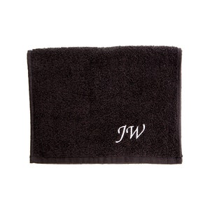 May include: A black towel with the initials "JW" embroidered in white.