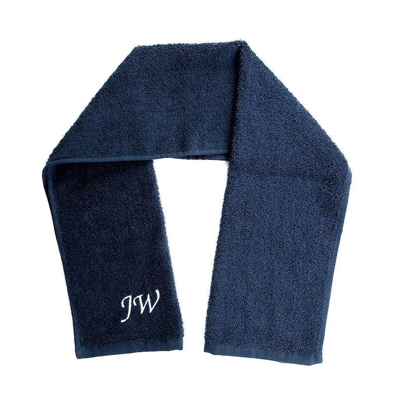May include: A dark blue towel with the initials "JW" embroidered in white.