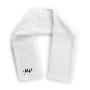 May include: White towel with the initials "JW" embroidered in black.