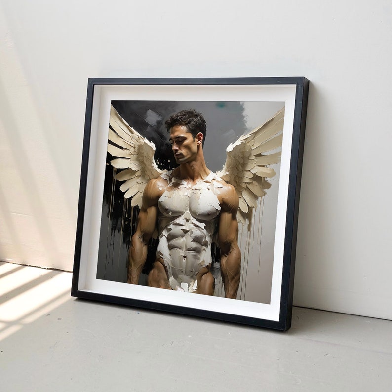 May include: A black framed print of a muscular figure with white wings. The figure is standing with their arms at their sides and looking down. The background is a dark gray.
