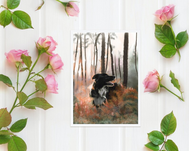 May include: An art print depicting a black and white dog in a forest scene. The dog is central, set against a backdrop of tall trees and autumnal foliage. Pink roses and green leaves are arranged around the print on a white surface.