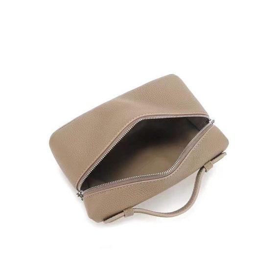 L19 Pouch in Real Cowhide Leather Neo Clutch Crossbody Seen on -  Israel