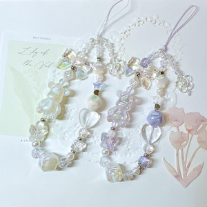 May include: A set of three ceramic mugs with a speckled, matte finish. The mugs are in shades of cream, light gray, and dark gray. Each mug has a simple, minimalist design, perfect for coffee or tea.