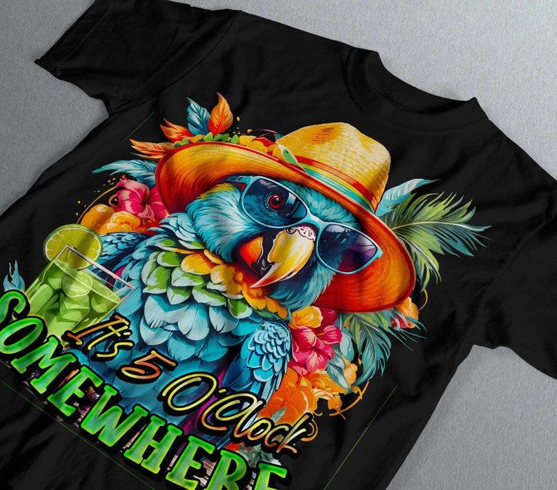May include: A black t-shirt featuring a colourful parrot wearing sunglasses and a straw hat. The parrot is surrounded by tropical flowers and leaves. The text "It's 5 O'clock Somewhere" is printed on the shirt.