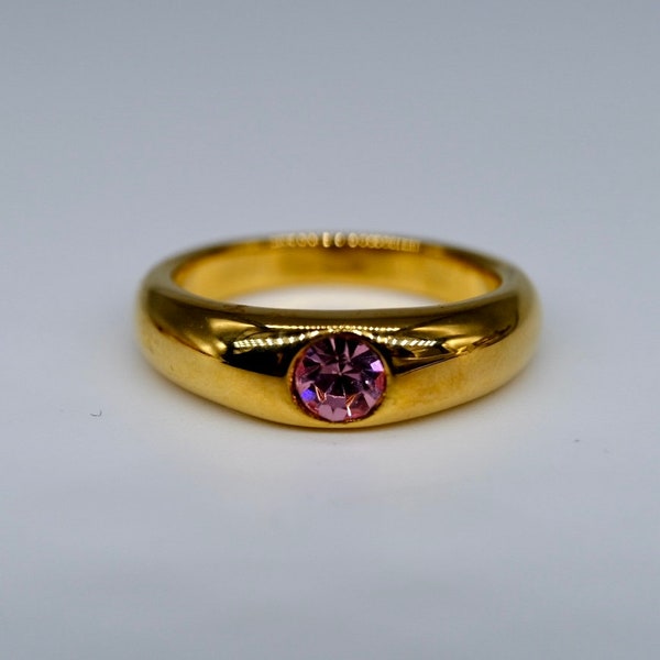 A fantastic vintage affordable pink paste gypsy ring mounted in plated gold, circa 1990
