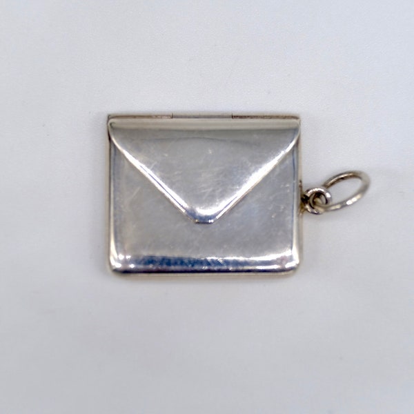 A wonderful antique silver opening envelope pendant formally used for stamps, marked 925, circa 1910