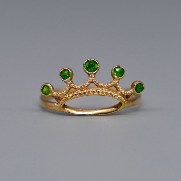 A rather fabulous and rare antique demantoid garnet crown ring mounted in a 9ct yellow gold mount.  circa 1900