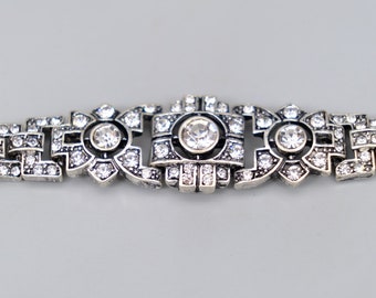 A rather fabulous 1930s geometric paste bracelet in white metal that can be shortened by taking a link out, circa 1930