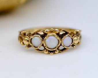 A pretty stylised vintage trilogy opal ring, 9ct yellow gold, circa 1960