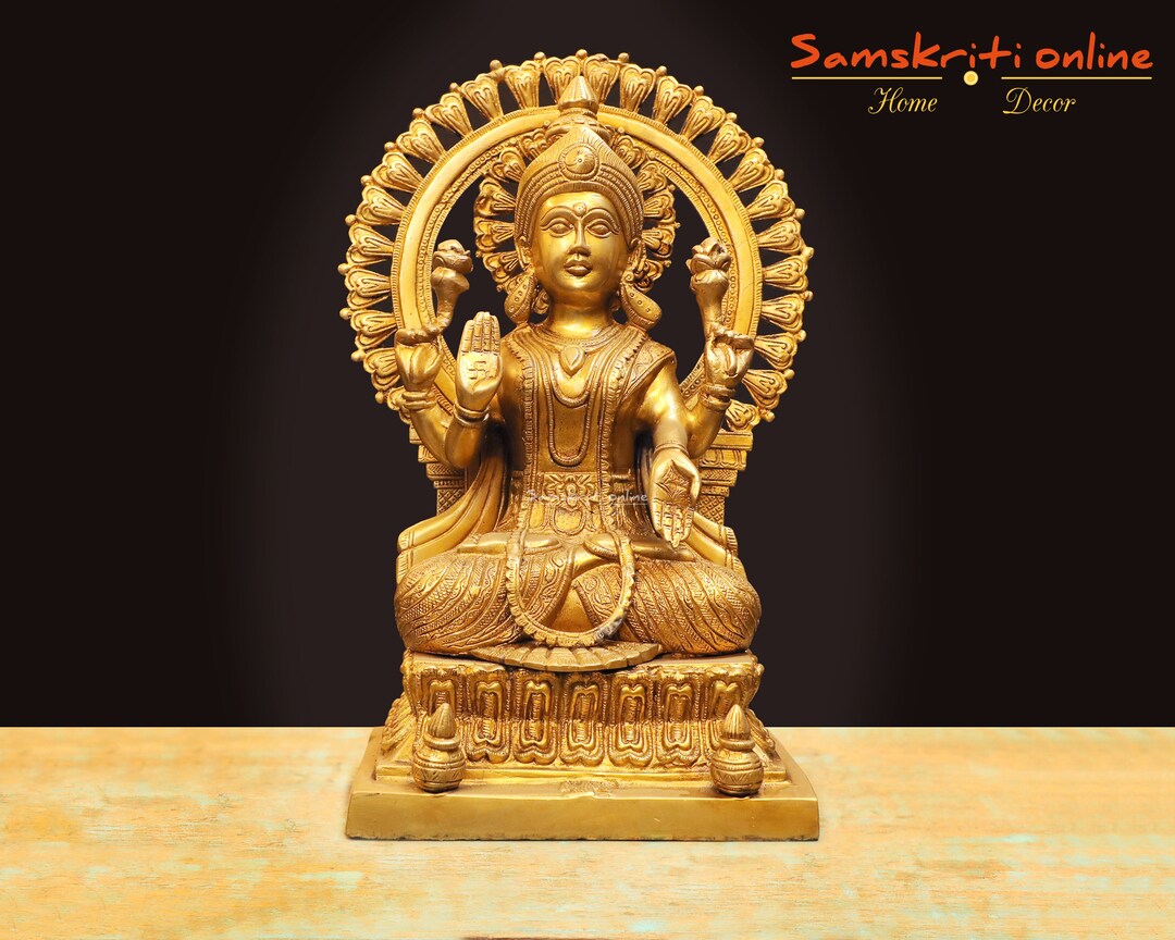 Brass Goddess Lakshmi Statue Sitting on a Pedestal . Home Temple Statue