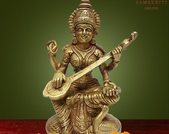 Exquisite Brass Goddess Saraswati statue sitting on a pedestal.  Handcrafted