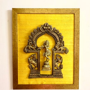 Exquisite Brass Prabhavali with mythical Yali and Lord Krishna mounted on big Gold Wall frame on raw silk.Temple frame handcrafted .