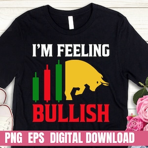 May include: Black t-shirt with a white graphic that says "I'm Feeling Bullish" with a yellow bull and green, red, and black bars representing a stock chart.