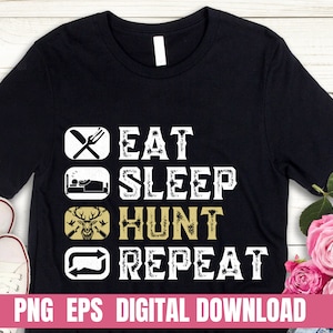 Puede incluir: Camiseta negra con texto blanco que dice "Comer Dormir Cazar Repetir" con un gráfico de cabeza de ciervo. El texto tiene un aspecto desgastado.