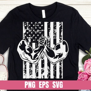 May include: Black t-shirt with a white distressed American flag design featuring two muscular arms arm wrestling. The text "PNG EPS SVG" is at the bottom of the shirt.