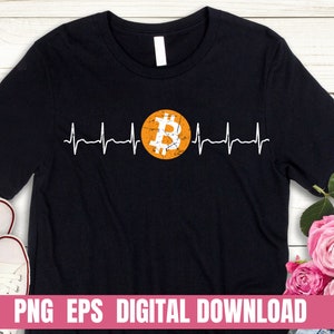 May include: Black t-shirt with a white heartbeat graphic and a gold Bitcoin symbol in the center. The text "PNG EPS DIGITAL DOWNLOAD" is at the bottom of the image.