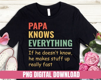 May include: A black t-shirt with a vintage-style graphic that says "Papa Knows Everything" in yellow, green, and orange text. Below the text, it says "If he doesn't know, he makes stuff up really fast".