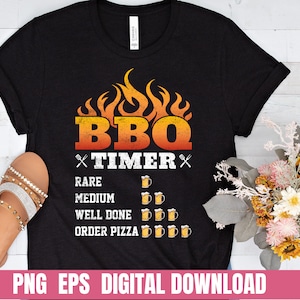May include: Black t-shirt featuring a graphic of flames and the text "BBQ TIMER". The graphic also includes beer mugs and the text "Rare, Medium, Well Done, Order Pizza".