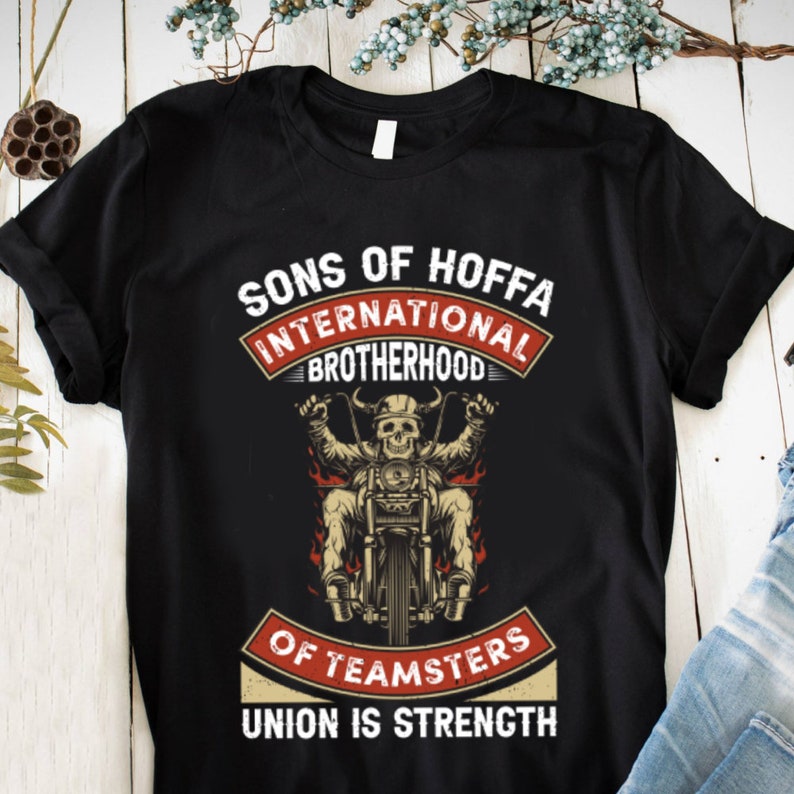 May include: Black t-shirt with a graphic of a skeleton riding a motorcycle. The text "Sons of Hoffa International Brotherhood of Teamsters Union is Strength" is printed on the shirt.