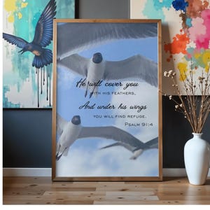 Pode incluir: Impressão emoldurada com gaivotas voando contra um céu azul. Inclui o texto: "Ele te cobrirá com as suas penas, e debaixo das suas asas encontrarás refúgio. Salmo 91:4."