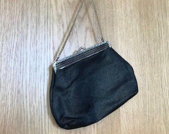 Elegant black and gold glittering bag with metal chain and clip closure