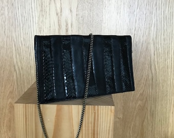 Clutch evening bag 70s black leather with gold-colored metal chain