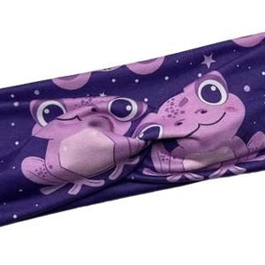 May include: Purple headband with a repeating pattern of pink frogs and white stars. The headband is twisted in the middle.