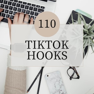 May include: Overhead shot of a workspace with a laptop, phone, and accessories. The image features the text "110 TikTok Hooks" in a large font, along with a beige circle with the number 110. Other items include pencils, glasses, and a marble-patterned phone case.