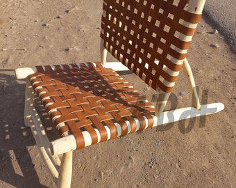 Moroccan armchair handcrafted in wood seated in natural leather