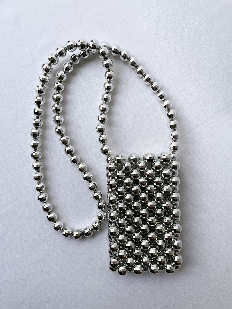 No 9 Silver Bag Mini This stunning bag is perfect for carrying your essentials on a night out. Add some luxury to your outfit. image 7