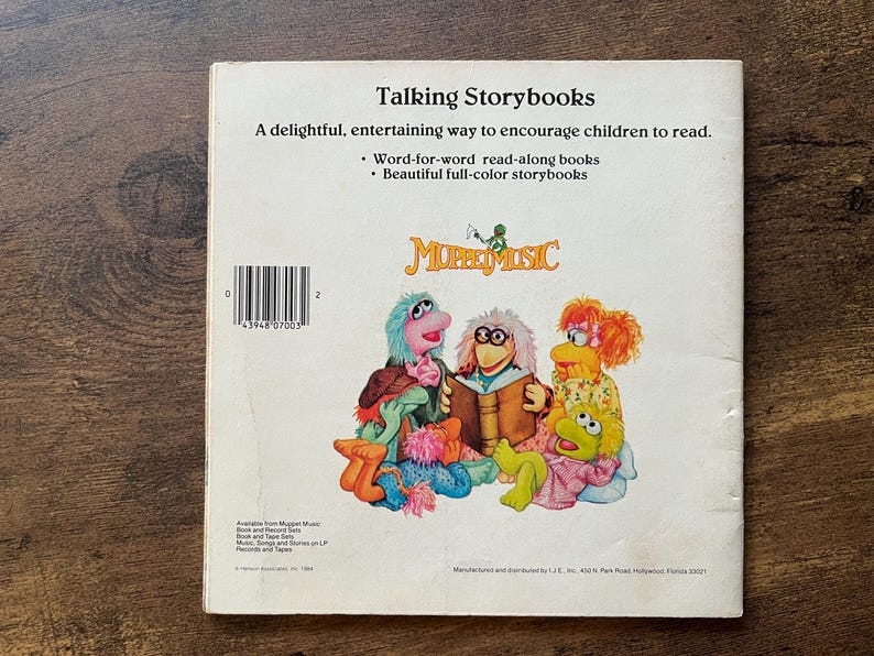 May include: A white back cover of a Talking Storybooks book featuring the Muppet Music logo and a colorful illustration of various Muppet characters. The text includes the title, a description of the read-along books, and a barcode.
