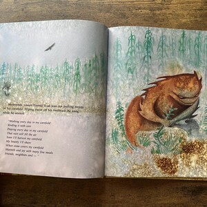 May include: An open children's book featuring a brown, horned toad creature sitting in a green cornfield. The left page contains printed text about a horned toad working in a cornfield, while the right page shows the creature in a field.