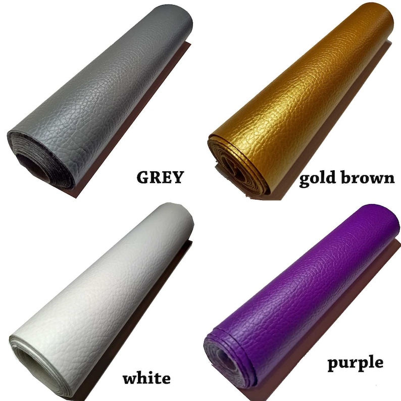 May include: Four rolls of faux leather in different colors: grey, gold brown, white, and purple. The rolls are all rolled up and the ends are visible.