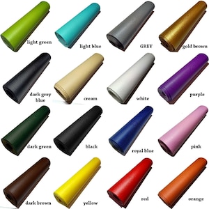 May include: A collection of 16 rolled up pieces of leather in various colors, including light green, light blue, grey, gold brown, dark grey blue, cream, white, purple, dark green, black, pink, royal blue, red, dark brown, yellow, and orange.