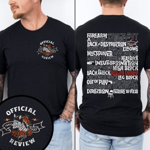 May include: A black t-shirt with a white graphic on the front that says "Official Review" and a zebra with roses. The back of the shirt has a white graphic with the text "Forearm Track Cut, Illegal Contact, Pack Destruction, Revival, Stopped Block Elbows, Multiplayer Low Block, Failure to Reform Head Block, Insubordination, Delu of Game High Block, Back Block Roller Derby, Clockwise Block Leg Block, Out of Play Misconduct, Blocking Out of Bounds, Direction Failure to Yield".