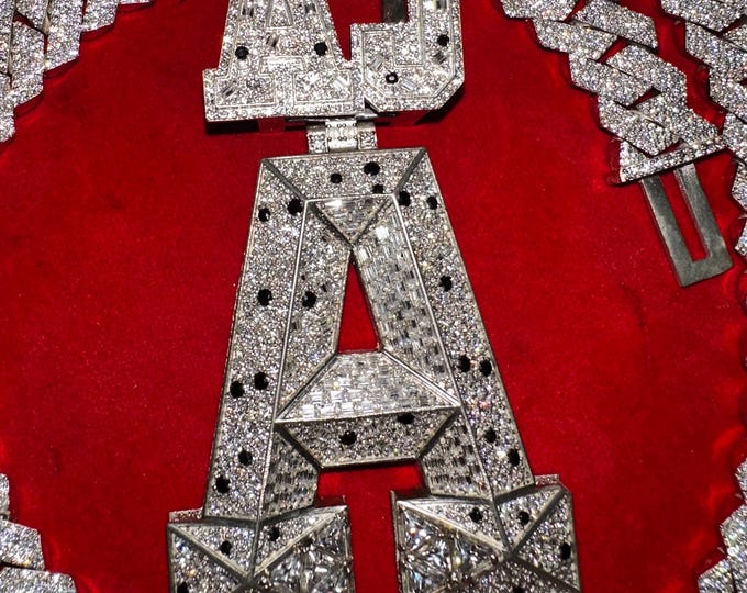 This stunning fully iced-out custom “AJ-A” pendant is crafted with premium detailing and a luxury finish Perfect hip-hop jewelry, rappers