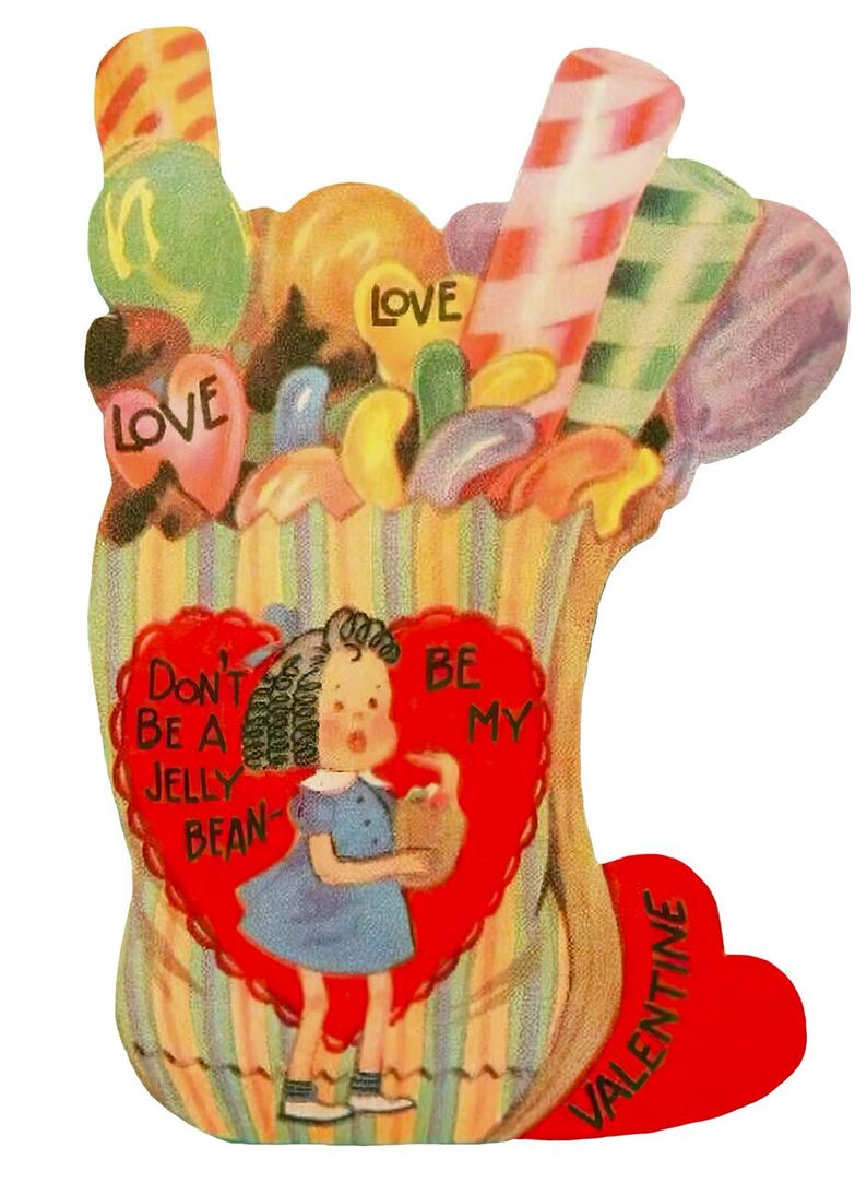 May include: A vintage Valentine's Day card depicting a girl in a blue dress with a basket. The card is shaped like a bag of sweets and includes the phrases "Don't be a jelly bean" and "Be my Valentine."