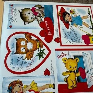 May include: A sheet of vintage Valentine's Day cards with illustrations of a kitten, owl, girl, and teddy bear. The cards have red heart accents and text such as "To the Sweetest One of All" and "I'm bringing my heart for Valentine's Day."