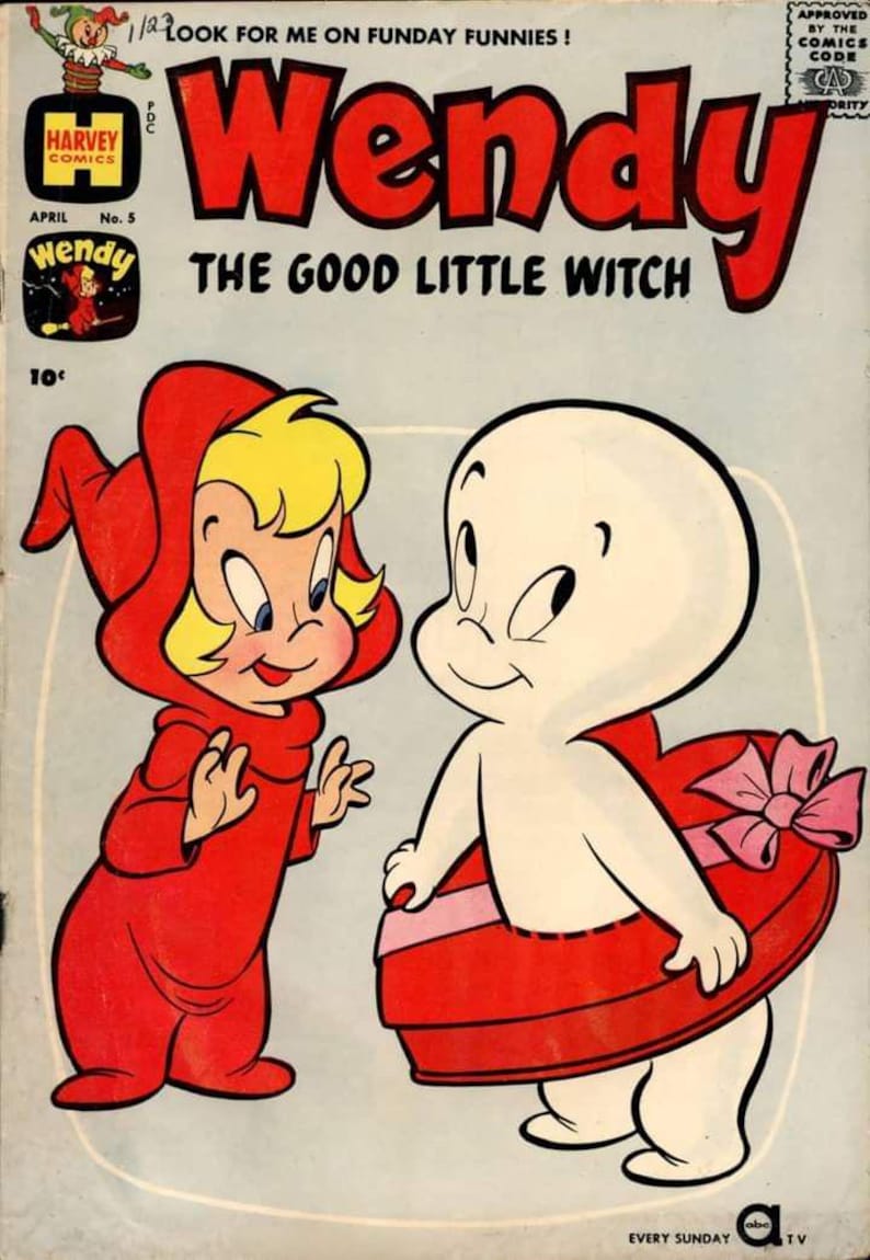 Pu&ograve; includere: Copertina di fumetto con Wendy la buona piccola strega e Casper il fantasma amichevole. Wendy, in un abito rosso con cappuccio, &egrave; accanto a Casper, che indossa un regalo a forma di cuore. Il titolo "Wendy" &egrave; in grandi lettere rosse.