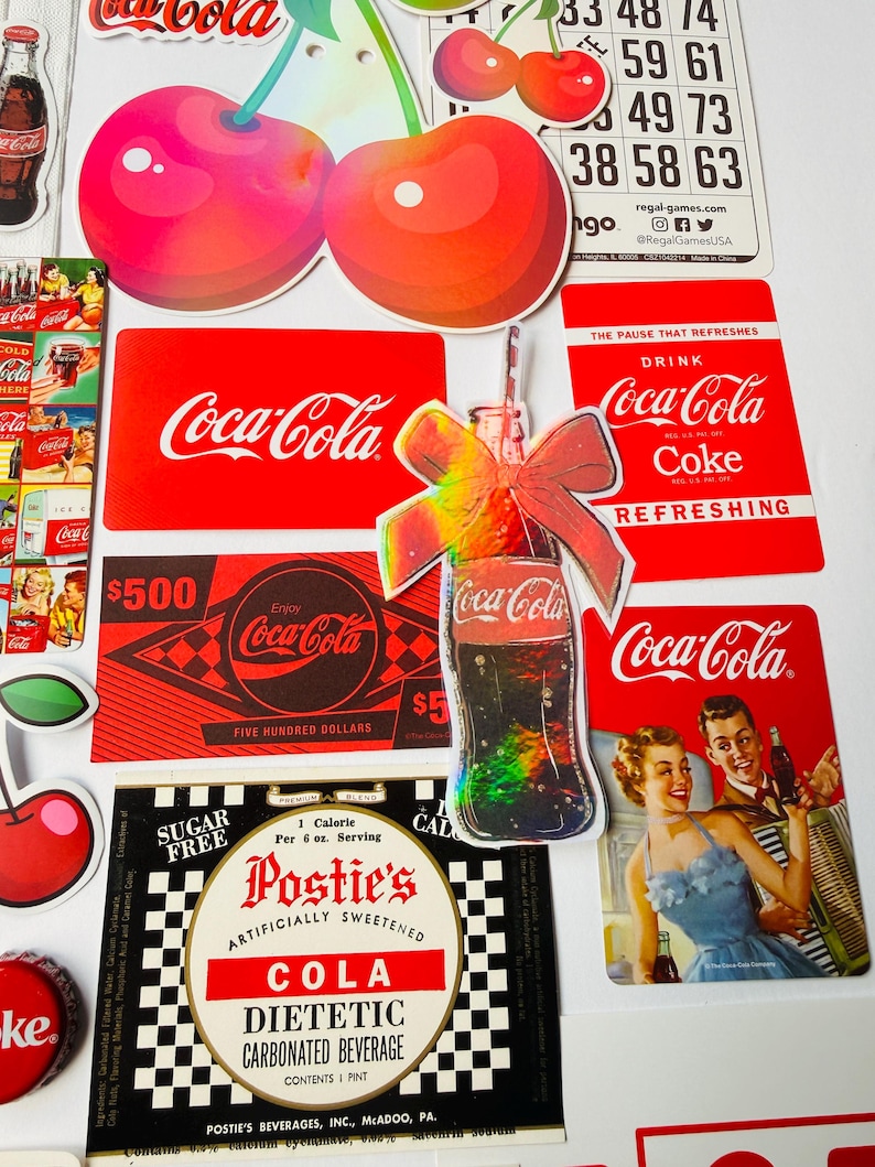 May include: A collection of Coca-Cola themed stickers and cards featuring red and white branding, vintage advertisements, a holographic bottle sticker with a bow, cherry illustrations, a bingo card, and a Postie's diet cola label with text.